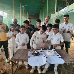 Parth Rane cutting his birthday cake, surrounded by his cheering teammates and coaches. We celebrate every player's special day.