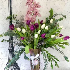 A closer look at the textures in this tulip and orchid arrangement. I carefully select complementary flowers and foliage to create depth and interest in every bouquet.
