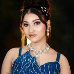 A sleek and modern high bun, adorned with sparkling accessories. We teach our students to create clean, polished hairstyles perfect for any party or event.
