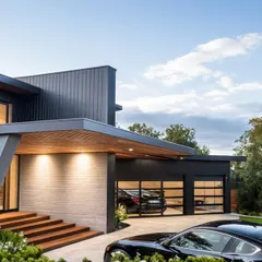 The entryway of this contemporary Seattle bungalow makes a statement with its bold, straight lines and clean, geometric forms. The design focuses on open spaces and fluid transitions, creating an aesthetic that is both impactful and elegantly simple.