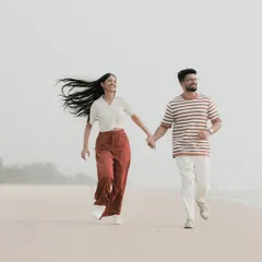 The pure joy of running together on a quiet Mangaluru beach. I focus on capturing these energetic, unposed moments where your personalities shine through, creating memories filled with laughter.