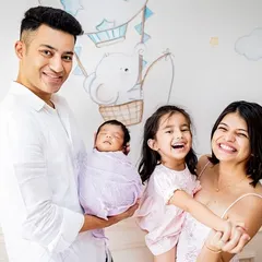 A beautiful family of four celebrating their newest member. I love capturing these moments against the backdrop of your baby's own nursery.