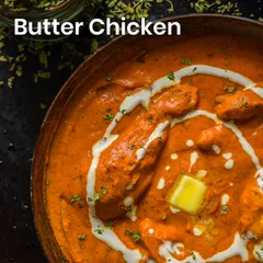A close-up of my creamy and rich Butter Chicken, a perfect winter comfort food. The swirl of cream and pat of butter on top adds to the indulgence.