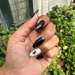 I can do wacky and fun designs too. This client wanted a dragonfly, and I hand-painted it on a white accent nail to contrast with the glossy black extensions.