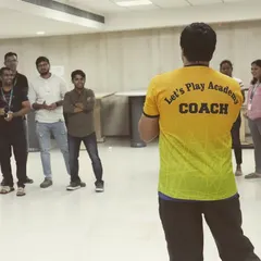 A coach from our team setting the stage for a corporate wellness workshop. We start by explaining the activities and getting everyone motivated for a fun and productive session.