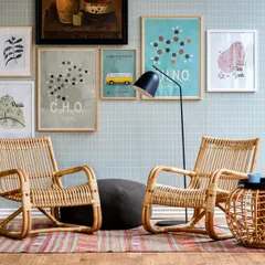 Here are two of my classic rattan lounge chairs used together in a living room. This setup shows their versatility and how they can serve as primary seating in a casual, stylish space.