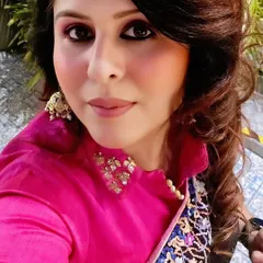 A close-up of my party look. I love pairing a collared blouse with a saree for a modern twist, and the makeup is all about a bold eye and radiant skin.