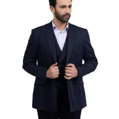 This shot showcases a classic double-breasted navy suit. The model's confident stance and the clear view of the tailoring are ideal for highlighting the quality of the garment.