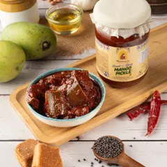 For this mango pickle shoot, I created a rustic, traditional scene to highlight the product's authentic flavor. The composition includes key ingredients like raw mangoes, jaggery, and spices to tell a complete story of taste and quality.