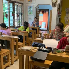 This is our quiet corner of calm in Jayanagar. With wooden desks and a focused, peaceful energy, our studio is a space where you can disconnect from the rush and reconnect with your creativity.