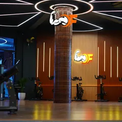 The spacious and modern design of our Group X studio. This wide shot shows the spin bikes, sleek lighting, and clean, open floor plan that defines our premium workout space.