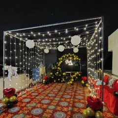 This 'Bride to be' setup shows a full view of the fairy light canopy. The structure creates an enclosed, magical space perfect for evening celebrations on a rooftop or in a garden.