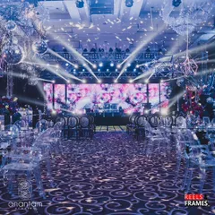 The stage is set for a retro disco night. This image captures the high-energy lighting, massive LED screen, and scattered disco balls that transformed the venue into an 80s dance party, complete with transparent ghost chairs for a modern touch.