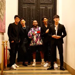 Posing with the crew before a pool party event. It's not just about the music; it's about the people you share the experience with.