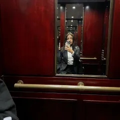An elevator selfie reflecting on a sense of accomplishment after a long and challenging day. The life of a lawyer, especially one handling international cases, involves many silent battles. It's about having the himmat to keep going, choosing your battles wisely, and being your own biggest supporter.