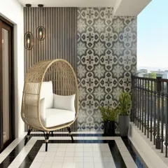 This modern balcony design combines a stylish rattan egg chair with bold patterned tiles. The black and white flooring creates a strong graphic statement, making the space feel both contemporary and comfortable.