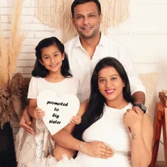 Promoted to big sister! I love capturing the moment when the whole family shares in the joy. This beautiful studio portrait shows a family eagerly awaiting their newest member.