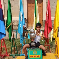 Pure joy and accomplishment. Here is Irvin, one of our junior champions, on the podium after winning the athletic championship in his category.