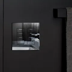 This architectural glass finish Palladiom keypad by Lutron is an elegant choice for dark, modern walls. The reflective surface and clean lines provide sophisticated control for lighting scenes like 'Energize', 'Glam', and 'Entertain'.
