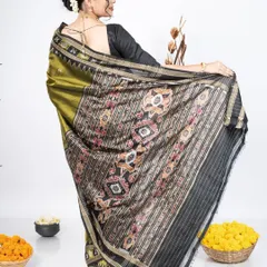 The back view is just as important as the front. Here, the pallu is draped to elegantly display its detailed border and artwork. This style ensures the saree looks complete and graceful from behind, perfect for event photography.