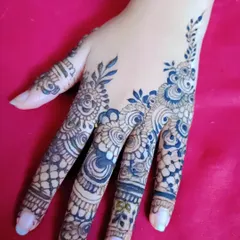 A close-up of a single hand showing a detailed finger design. This is perfect for someone who wants a touch of henna without a full-hand application.