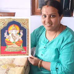 My student Indu proudly holding her finished Tanjore painting. This art form requires patience and precision, and she has done a fantastic job.