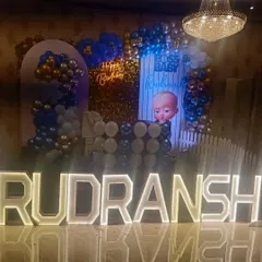 A closer look at the Rudransh's Boss Baby stage setup. The combination of the lit-up letters and the detailed backdrop creates a fantastic focal point for the party.