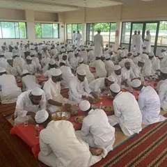 Guests enjoying the meal at the Mahed Al Uloom Al Islamia Madrasa. I am committed to providing delicious and hearty food for community events of any scale.