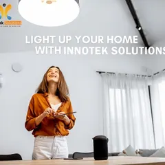 With our smart home systems, you have complete control at your fingertips. Here, a client uses a tablet to adjust the lighting in their living room, creating a bright and welcoming atmosphere with ease. Voice control via a smart speaker is also an option.