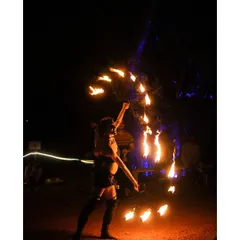 Capturing the mesmerizing art of fire dancing. The long exposure trails of the flames create a dynamic and magical effect in the dark.