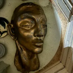 The evolution of a sculpture. This series shows a hand-built portrait bust from its raw clay form, to post-bisque firing, and finally with two different metallic glaze finishes.