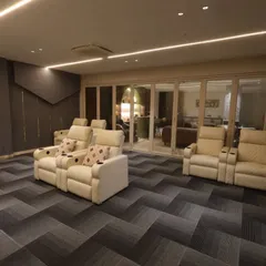 The space is connected to the bar and lounge area through a large glass sliding door, allowing for seamless entertaining.