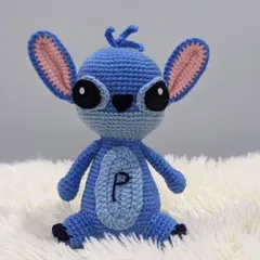 I also create beloved characters from movies and shows. This is Stitch from Lilo & Stitch, personalized with the initial 'P' on his belly, making it a unique gift for any fan.
