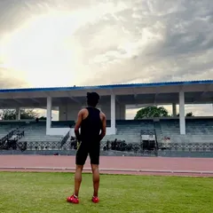 Taking a moment to look over the track at the stadium. This is my field of work, where I help athletes turn their potential into performance.
