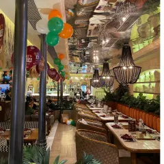 For this restaurant's Republic Day celebration, I used simple balloon strings in the Indian tricolor to decorate the ceiling, adding a festive touch without cluttering the space.
