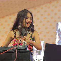 A huge smile on my face during a fun Garba night set. The energy of these cultural events is infectious, and I love being a part of it.