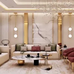 This living room is the epitome of luxury, featuring a plush cream sofa accented with deep red armchairs and gold detailing. The design incorporates a marble feature wall, ornate pendant lighting, and classic wall molding to create a space of timeless sophistication.