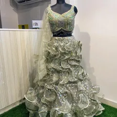 Another view of the stunning green ruffled gown-style lehenga, perfect for making a grand entrance at any evening event.
