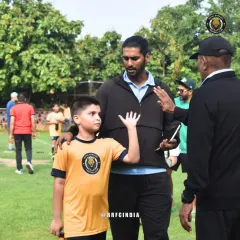 A moment of connection between a player and our coaches. We believe in open communication and building trust, which is why kids feel comfortable approaching our coaching staff.