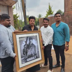 The team and I presenting the large, framed 'Ghost' artwork on set.