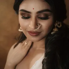 A close-up of a dramatic smokey eye look created for a photoshoot. The focus is on the deep, blended eyeshadow and flawless skin, perfect for high-impact portraits.