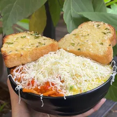 Can't decide between red or white sauce? With my special Pasta & Pasta, you don't have to. I serve both creamy white sauce and tangy red sauce pasta in the same bowl, topped with plenty of cheese and served with garlic bread.