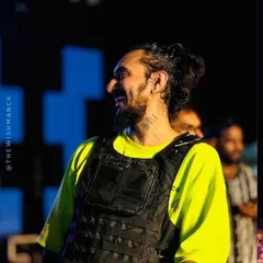 A candid smile during my set at the Kerala Auto Expo. It's a great feeling to connect with such a large and enthusiastic audience.