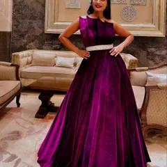 A client looking absolutely radiant in the magenta velvet gown. This photo shows how the rich fabric and bold color can make anyone feel classy and sassy for their special event.