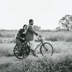 A classic black and white photo from a retro-themed pre-wedding shoot, giving it a timeless, cinematic quality like a scene from an old movie.