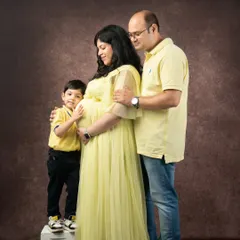 The whole family together, lovingly touching the baby bump. This pose beautifully symbolizes the love and anticipation shared by everyone for the new arrival.