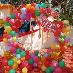 We design fun and vibrant decor for corporate parties. This colorful circular balloon arch, created for an outdoor Holi celebration, serves as a perfect photo booth and adds a burst of energy to the event.