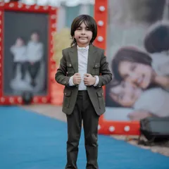 Posing for the camera. Our coordinated shacket sets are perfect for family photoshoots, parties, or any occasion where you want your boys to share a special look.