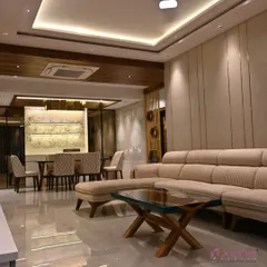 I believe in creating spaces that feel both grand and welcoming. This living and dining room project in Thane features custom furniture, layered lighting with a false ceiling, and a cohesive color palette to connect the two zones.