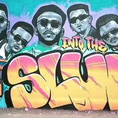 The full graffiti mural for the hip-hop group 7Bantaiz. The word "SLUM" is written in a bold, colorful wildstyle, with portraits of the artists integrated into the background.